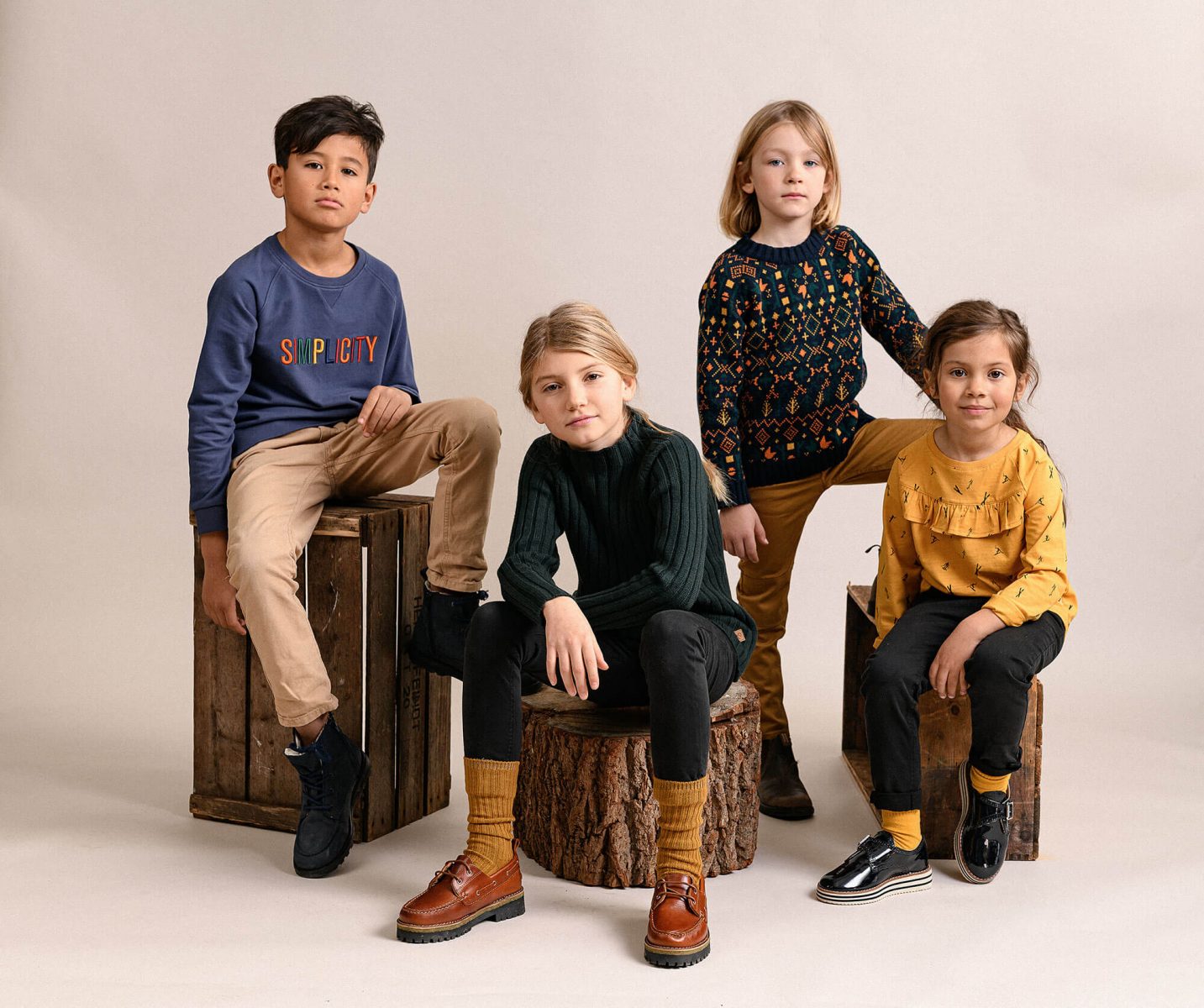 Bunch of kids posing in a studio environment