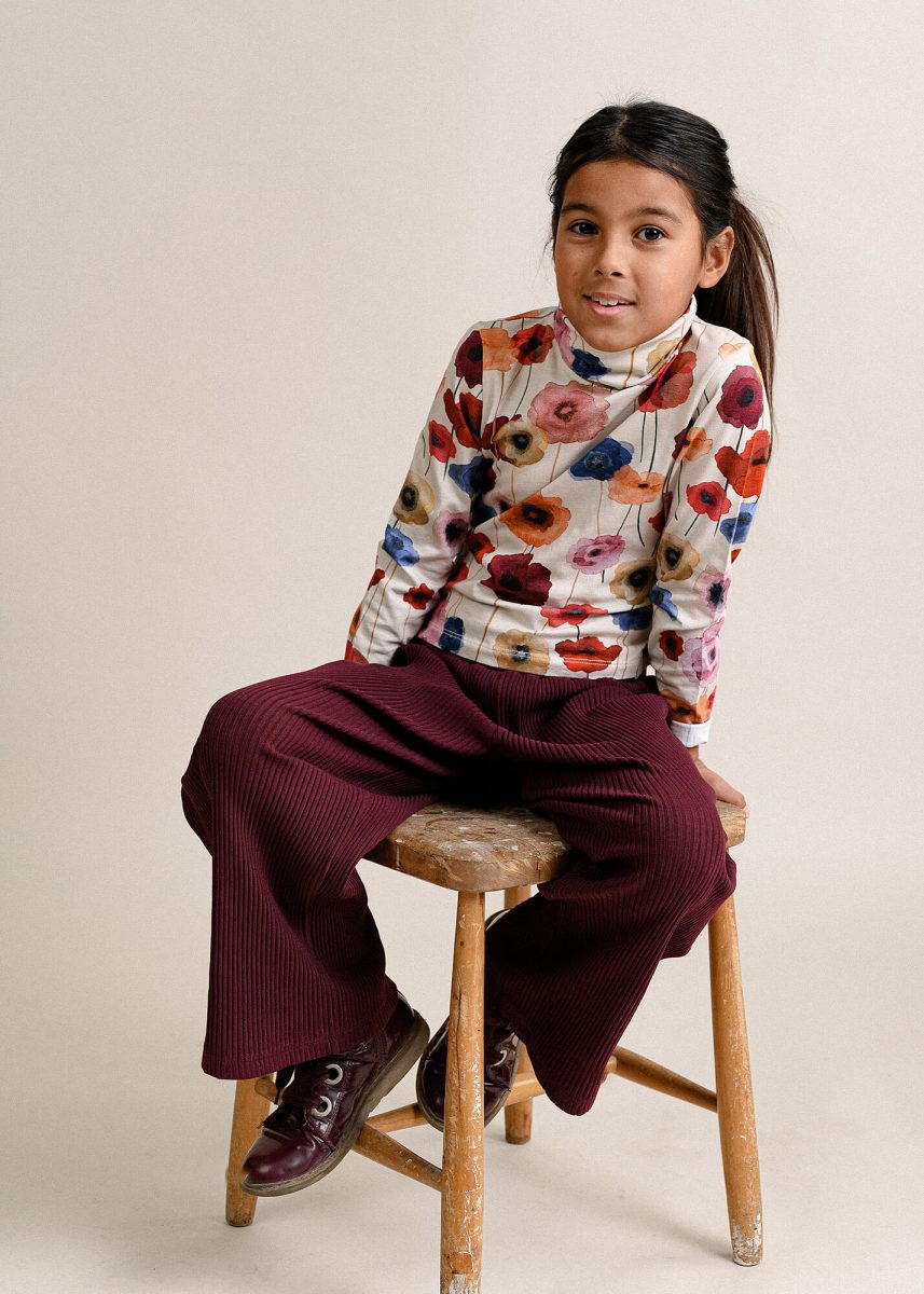 Kids portrait in studio, sitting on a stool