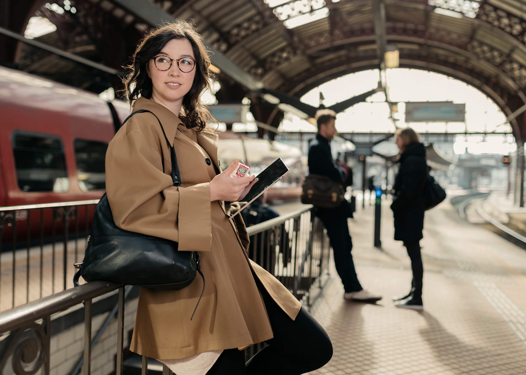 Woman on train station. Product photo of a Tac Tac.