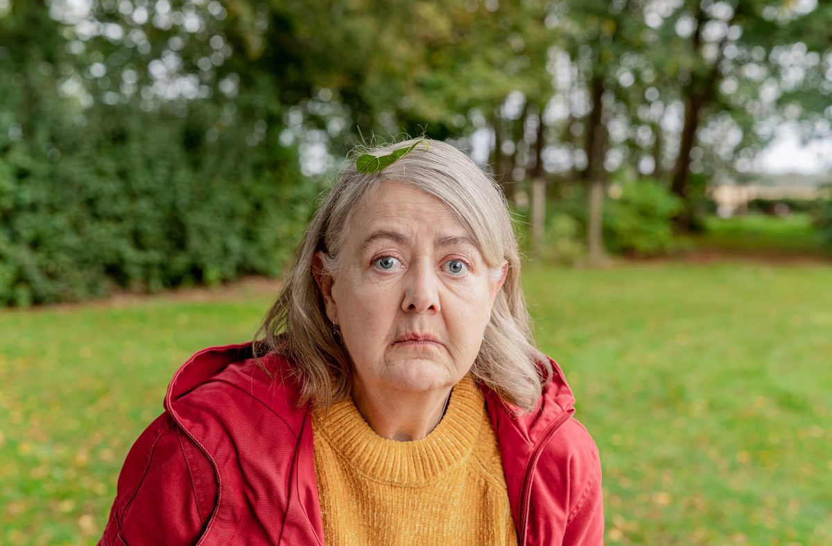 Sad woman in garden. Crashed a drone.